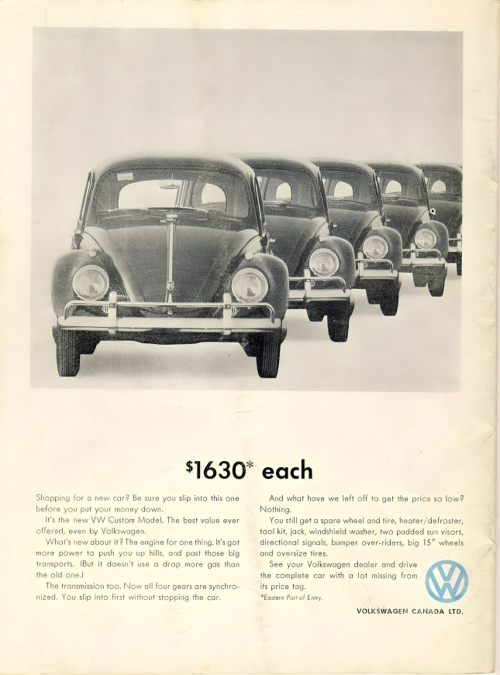 Vintage Volkswagen Canada ad showing four identical Beetles promoting the VW Custom Model and its features