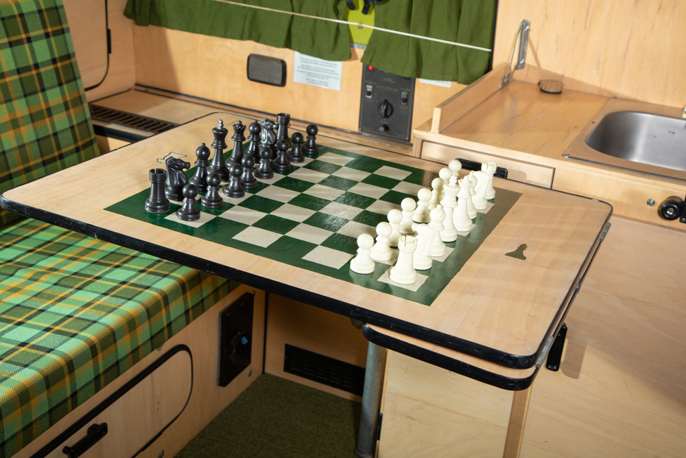 Custom light wood grain VW Westfalia interior cabinets and hand painted chess board