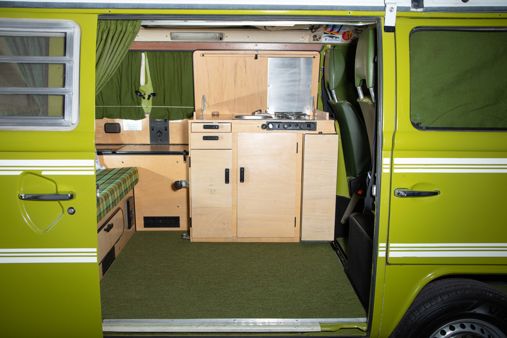 Custom sanded and stained light wood grain Westfalia interior cabinetry