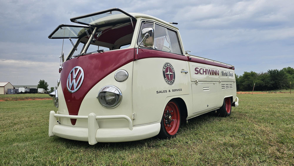Schwinn branded VW Single Cab with safari windows open on a grassy field